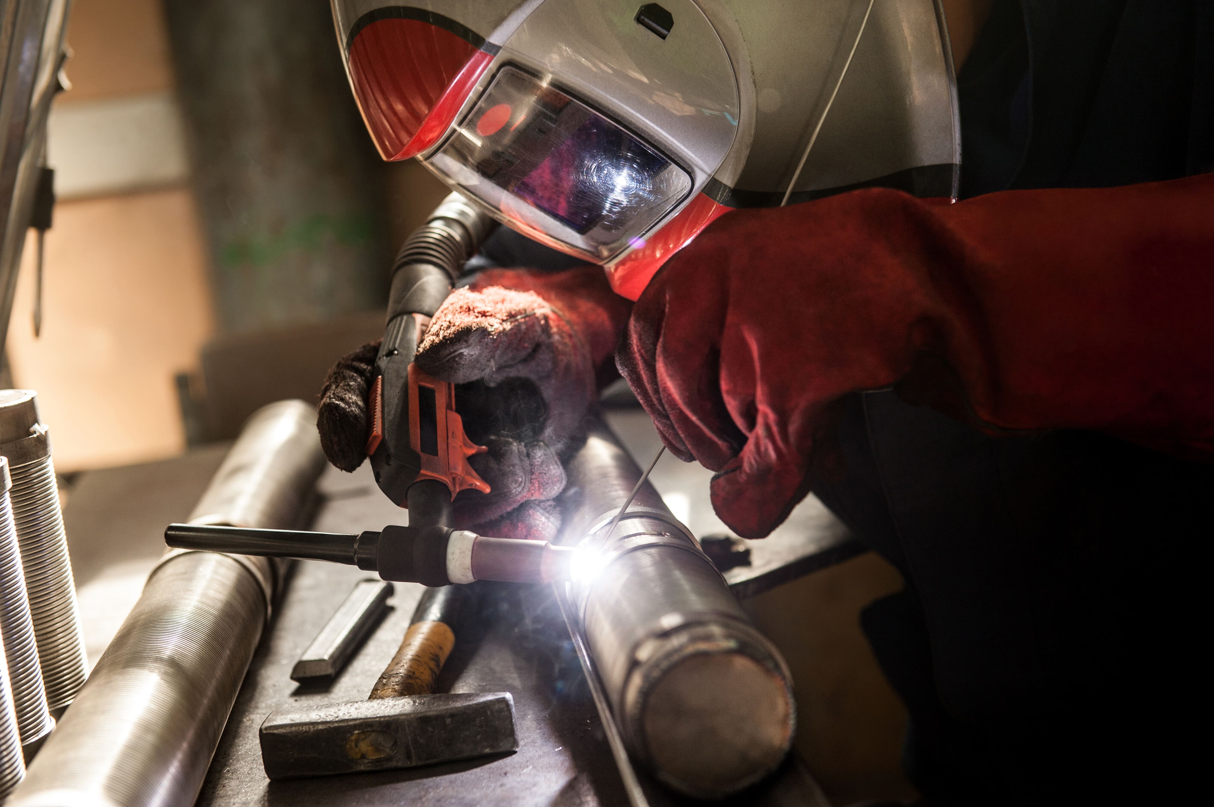 closeup-of-man-wearing-mask-welding-in-a-workshop-2024-05-30-07-41-37-utc.jpg